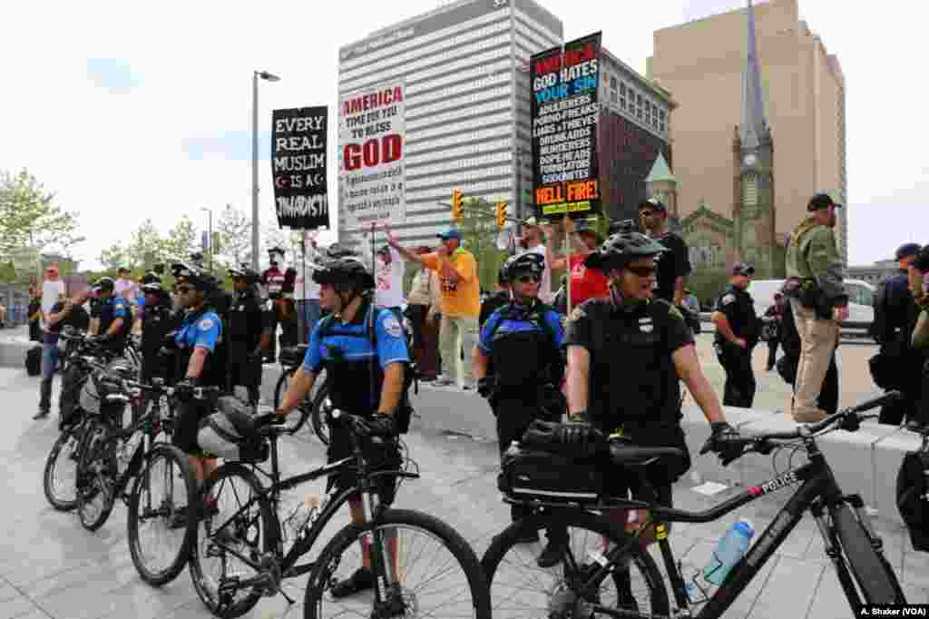 Police use their bicycles to form a line around protesters during the Republican National Convention, in Cleveland, July 21, 2016.