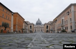 A view of St. Peter's Square, on the fourth day of an unprecedented lockdown across of all Italy imposed to slow the outbreak of coronavirus, as seen from Rome, Italy.