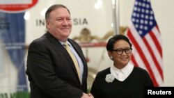U.S. Secretary of State Mike Pompeo shakes hands with Indonesian Foreign Minister Retno Marsudi during their meeting in Jakarta, Indonesia, Aug. 4, 2018.