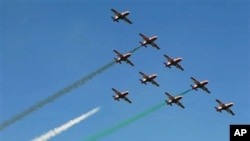 Indian air force aircraft perform aerobatic flight at the opening ceremony of Aero India 2011 in Yelahanka air base on the outskirts of Bangalore, India, February 9, 2011.