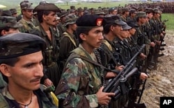 FILE - Revolutionary Armed Forces of Colombia (FARC) rebels, shown in 2000.