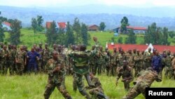 M23 soldiers demonstrate unarmed combat at Rumangabo military camp, North Kivu April 27, 2013. Rebels are honing their ambush skills to prepare to face a new United Nations force which has a mandate to go on the offensive. 