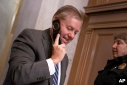 FILE - Senate Judiciary Committee Chairman Lindsey Graham, R-S.C., arrives at the Capitol on the morning after House and Senate negotiators worked out a border security compromise hoping to avoid another government shutdown, in Washington, Feb. 12, 2019.