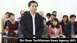 FILE - Vietnam's prominent blogger Nguyen Huu Vinh, shown on trial in Hanoi, Vietnam.