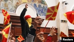 FILE - Protesters entered Macedonia's parliament after the governing Social Democrats and ethnic Albanian parties voted to elect an Albanian as parliament speaker in Skopje, Macedonia, April 27, 2017.