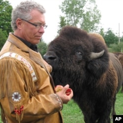 John Trippy, owner of the Wild Winds Buffalo Preserve, with one of his animals.