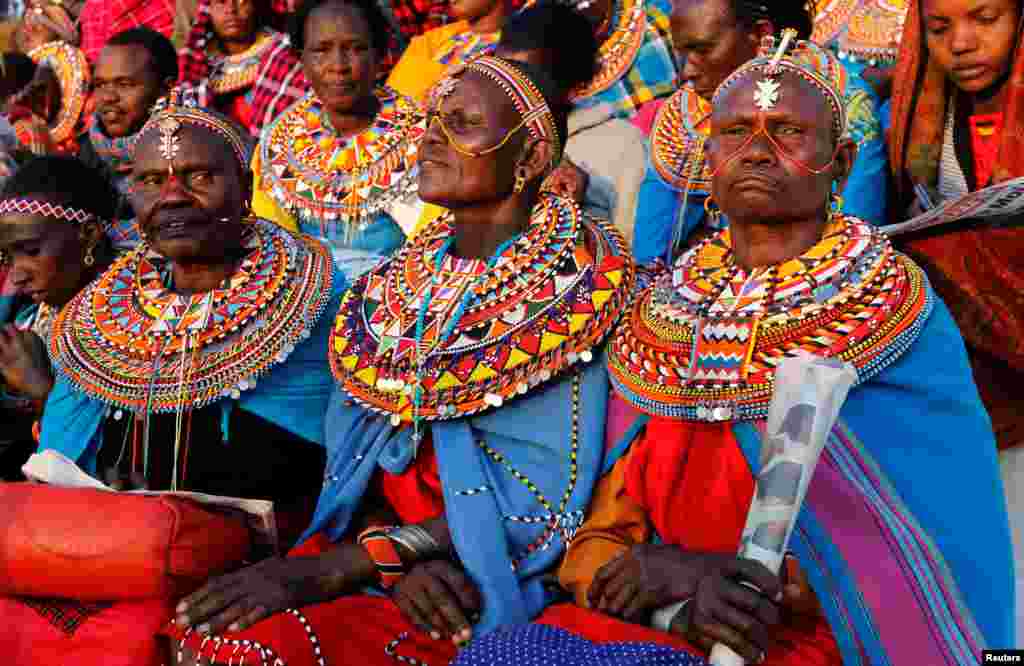 Maasai women dressed in traditional regalia attend a memorial service for late former Kenya&#39;s President Daniel Arap Moi at the Nyayo Stadium in Nairobi.