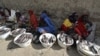 FILE - Fish vendors display their produce at a street market in Baga Sola, Jan. 26, 2015. 