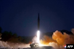This picture taken on Jan. 11, 2022, and released from North Korea's official Korean Central News Agency on Jan. 12, 2022, shows what North Korea says a hypersonic missile test-fire conducted by the Academy of Defence Science of the DPRK at an undisclosed location.