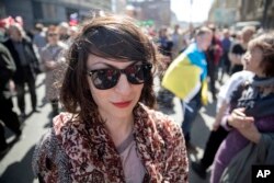 Protestor Nina Bereznyak attends an opposition rally in downtown Moscow, May 6, 2017, the anniversary of an opposition rally in 2012 that ended in violent clashes between demonstrators and police.