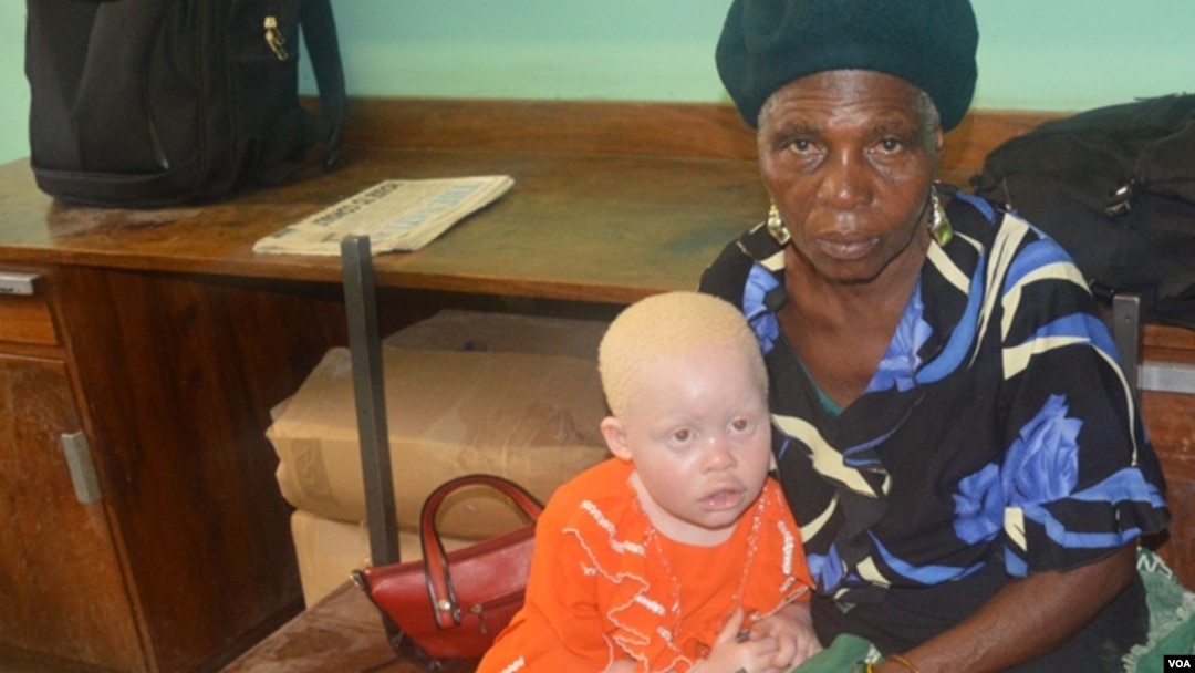 Enipher Foster of Chiradzulu district says the kidnappings has forced her to carry her granddaughter whereever she goes. (Lameck Masina for VOA News)