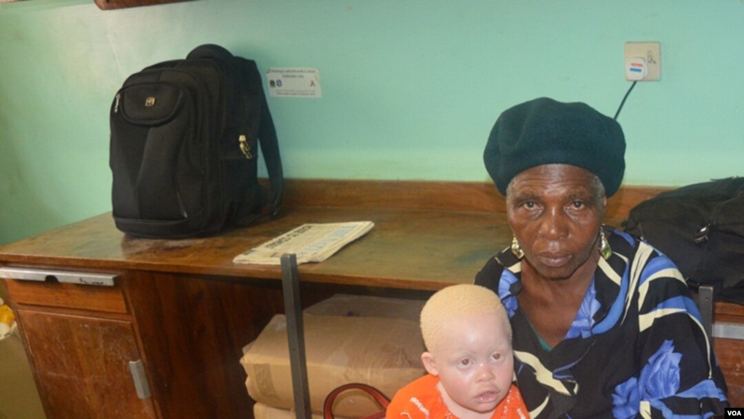 Enipher Foster of Chiradzulu district says the kidnappings has forced her to carry her granddaughter whereever she goes. (Lameck Masina for VOA News)