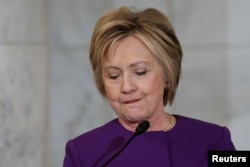 Former Secretary of State Hillary Clinton delivers remarks at a ceremony to unveil a portrait honoring retiring Senate Minority Leader Harry Reid in Washington, U.S. Dec. 8, 2016.