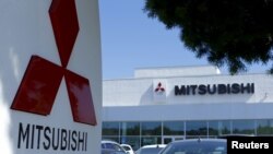 FILE - A Mitsubishi Motors dealership is shown in Poway, California, July 27, 2015. The Japanese automaker admitted that it falsified fuel-efficiency data on 625,000 vehicles.