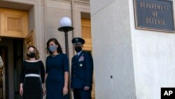 FILE - U.S. Deputy Secretary of Defense Kathleen Hicks, left, arrives at the Pentagon in Arlington, Virginia, Feb. 9, 2021.