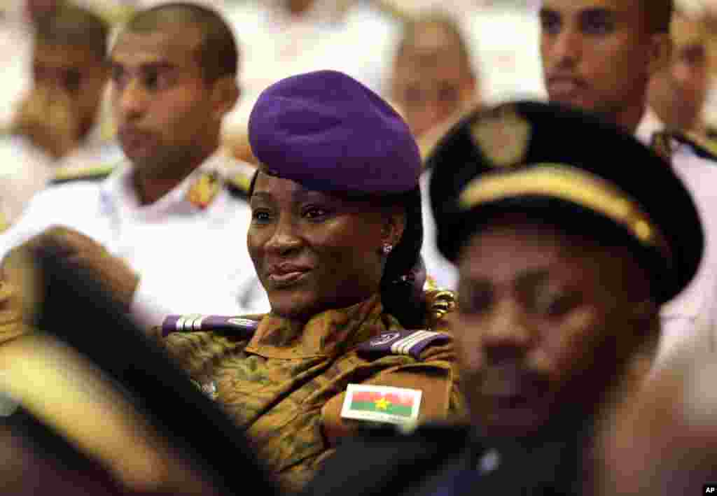 Judith Zoungnana, a Burkina Faso policewoman, smiles during a graduation ceremony from a security training course that included participants from several African and Commonwealth countries in Cairo, Egypt. 