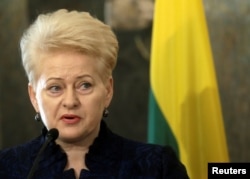 resident of Lithuania Dalia Grybauskaite addresses the media during a news conference in Riga, Latvia, Feb. 9, 2017.