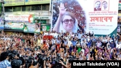 FILE - Supporters of Bangladesh’s main opposition party of BNP demand that their leader former PM Khaleda Zia be allowed to travel outside the country for medical treatment, during a protest in Dhaka, Nov. 30, 2021.