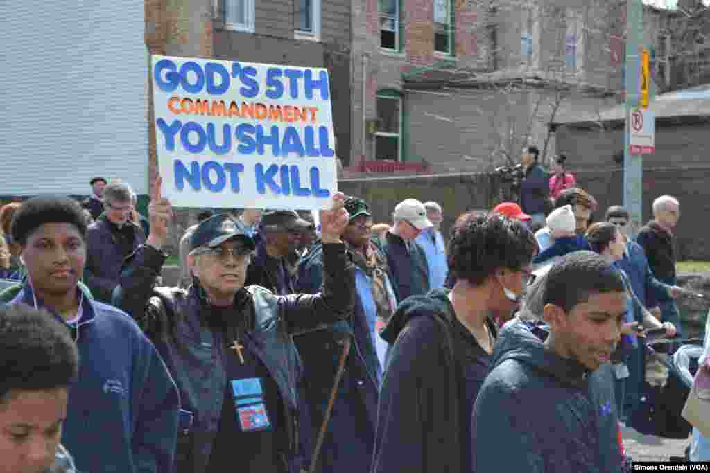 Participants march for peace in a prayer walk, April 14, 2017, through one Chicago neighborhood hit hard by gun violence, the Englewood neighborhood on Chicago's South Side. 