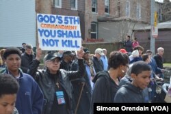 Participants march for peace in a prayer walk, April 14, 2017, through one Chicago neighborhood hit hard by gun violence, the Englewood neighborhood on Chicago's South Side.