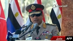 FILE - An image grab taken from Egyptian state TV shows Egypt's army chief General Abdel Fattah al-Sisi giving a live broadcast calling for public rallies to give him a mandate to fight "terrorism and violence." 