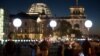 People pass by balloons of the art project "Lichtgrenze 2014" ("Lightborder 2014"), one of many events and displays in Berlin commemorating the fall of the Berlin Wall 25 years ago, Nov. 8, 2014. 