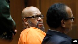 Former rap mogul Marion "Suge" Knight, left, with his defense attorney Albert DeBlanc Jr., listens to the terms of his plea of no contest to voluntary manslaughter in Los Angeles Superior Court, Sept. 20, 2018. 