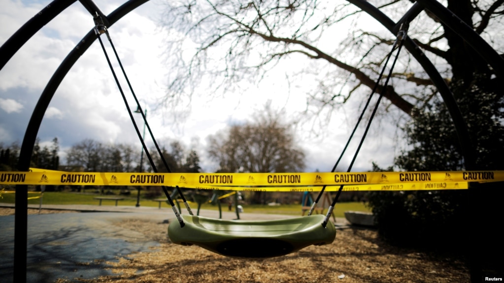 A children's playground is closed with caution tape amid the coronavirus disease (COVID-19) outbreak in Seattle, Washington, U.S., March 24, 2020. (REUTERS/Brian Snyder)