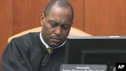 Judge Dwayne Woodruff hands down rulings from the bench in Pittsburgh, Pennsylvania's Juvenile Court