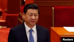 China's President Xi Jinping arrives at the closing ceremony of the Chinese People's Political Consultative Conference at the Great Hall of the People in Beijing, Mar. 12, 2014. 