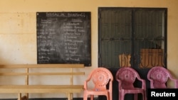 FILE - A blackboard with translations of French phrases into the Kanuri language is seen at a Cameroonian military base in Kolofata, Cameroon, March 16, 2016. 