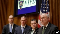 New York Police Commissioner Bill Bratton (R) speaks during a news conference at police headquarters, Feb. 25, 2015, in New York, regarding three men who were arrested on charges of plotting to travel to Syria to join the Islamic State group and wage war 