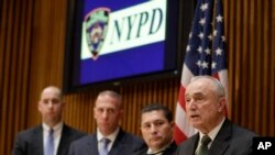 New York Police Commissioner Bill Bratton (R) speaks during a news conference at police headquarters, Feb. 25, 2015, in New York, regarding three men who were arrested on charges of plotting to travel to Syria to join the Islamic State group and wage war 