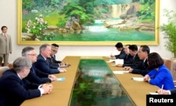 Vice Premier and Minister of Agriculture Ko In Ho meets David Beasley, U.N. World Food Programme's Executive Director, in this undated photo released by N. Korea's Korean Central News Agency (KCNA) in Pyongyang, May 11, 2018.