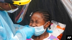 Dorah Cerisene, 9, gets tested for COVID-19, Aug. 31, 2021, in North Miami, Fla. 