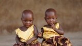 Identical twins Taiwo Adejare and Kehinde Adejare pose for a picture in Igbo Ora, Oyo State, Nigeria April 4, 2019. Picture taken April 4, 2019. REUTERS/Afolabi Sotunde