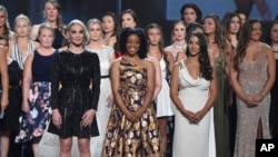 (From L-Front) Former gymnast Sarah Klein, former Michigan State softball player Tiffany Thomas Lopez and gymnast Aly Raisman, and others who suffered sexual abuse accept the Arthur Ashe Award for Courage at the ESPY Awards at the Microsoft Theater on July 18, 2018, in Los Angeles. 