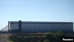 FILE - A view of the Amazon fulfillment center in Mexico City, Sept. 12, 2017.