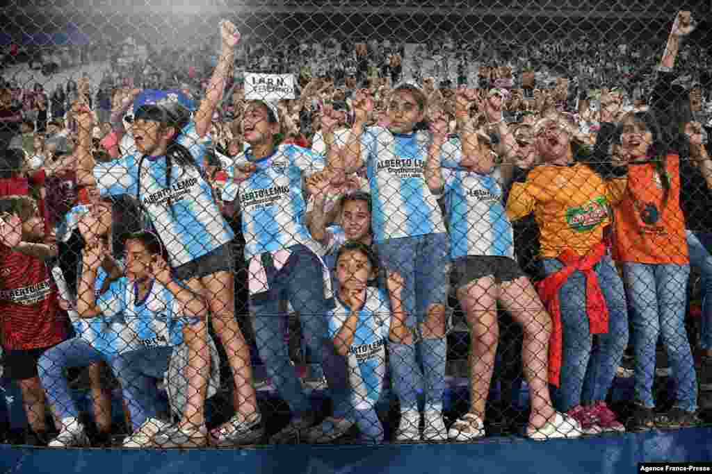 A group of girls react after Brazil&#39;s Corinthians defeated Colombia&#39;s Santa Fe in the Women&#39;s Copa Libertadores final football game, on November 21, 2021 at the Gran Parque Central stadium in Montevideo, Uruguay.