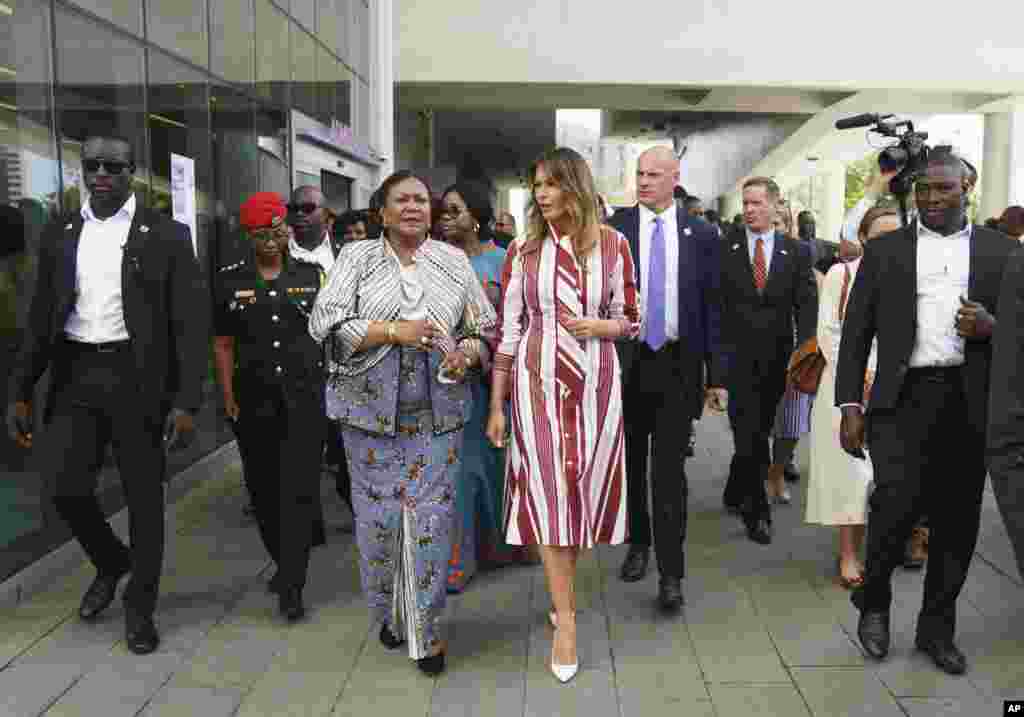 First lady Melania Trump and Ghana's first lady Rebecca Akufo-Addo walk to their vehicles as they leave Greater Accra Regional Hospital in Accra, Ghana, Oct. 2, 2018.
