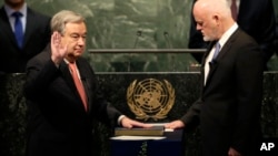 The United Nations Secretary-General designate Antonio Guterres, left, is sworn in by Peter Thomson, president of the UN General Assembly, at U.N. headquarters, Dec. 12, 2016. 