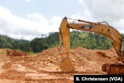 Excavators lie still at a small-scale gold mining site at the foot of the Atewa forest reserve in southeastern Ghana, May 23, 2019.