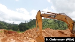 Excavators lie still at a small-scale gold mining site at the foot of the Atewa forest reserve in southeastern Ghana while government officials review the owners’ paperwork, May 23, 2019.