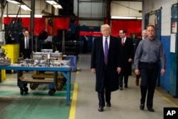 President Donald Trump participates in a tour of Sheffer Corporation during a visit to promote his tax policy, Feb. 5, 2018, in Blue Ash, Ohio.