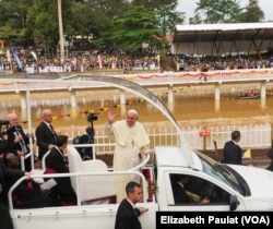 Pope Francis drove a loop around the main stage, greeting fans on all sides, before celebrating Mass in Namugongo, Uganda, Nov. 28, 2015.