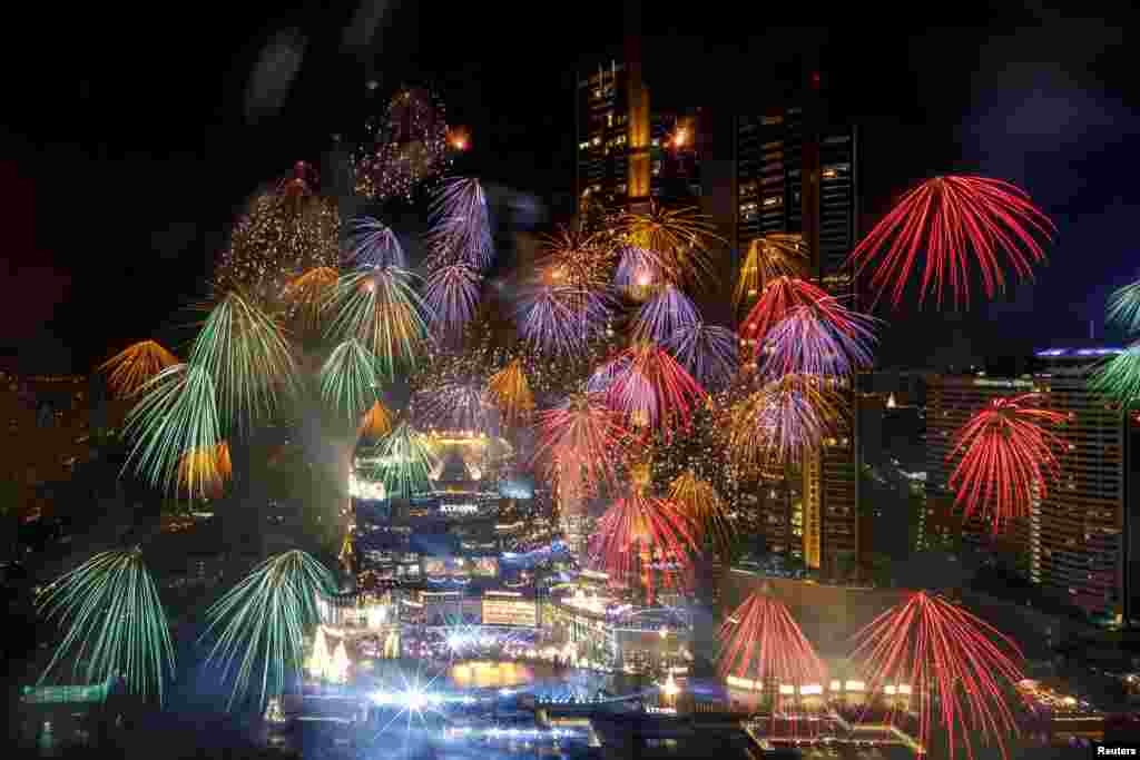 Fireworks explode over Chao Phraya River during the New Year celebrations amid the spread of the coronavirus disease in Bangkok, Thailand.