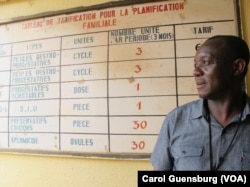 CDC epidemiologist John Ngulefac visits a community health center in Conakry, Guinea, while seeking clues about Ebola's spread.