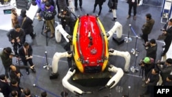 FILE - Visitors look at an undersea exploration robot during a drone show at the BEXCO Exhibition Hall in the southeastern port city of Busan, Jan. 19, 2017.