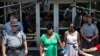 Nadine Collier, left, the daughter of Ethel Lance, one of the nine people killed in Wednesday's shooting at Emanuel AME Church, speaks to the media about her mother following the bond hearing for the suspected gunman, in North Charleston, S.C., June 19, 2