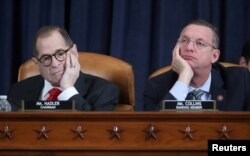 House Judiciary Committee Chairman Rep. Jerrold Nadler (D-NY) and ranking member Doug Collins (R-GA) listen to testimony as the committee holds a hearing to receive counsel presentations of evidence from the impeachment inquiry into U.S. President Donald